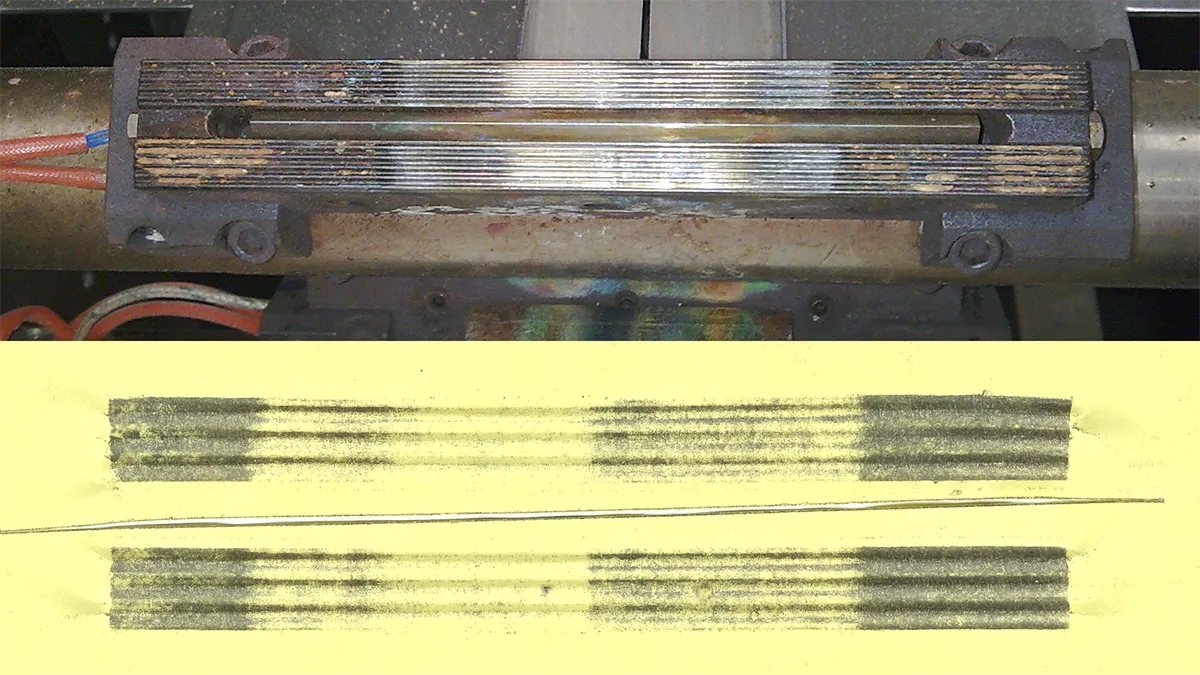 A sealing jaw carbon impression on carbon paper illustrating the sealing jaw's damage, product contamination, misadjustment, and alignment